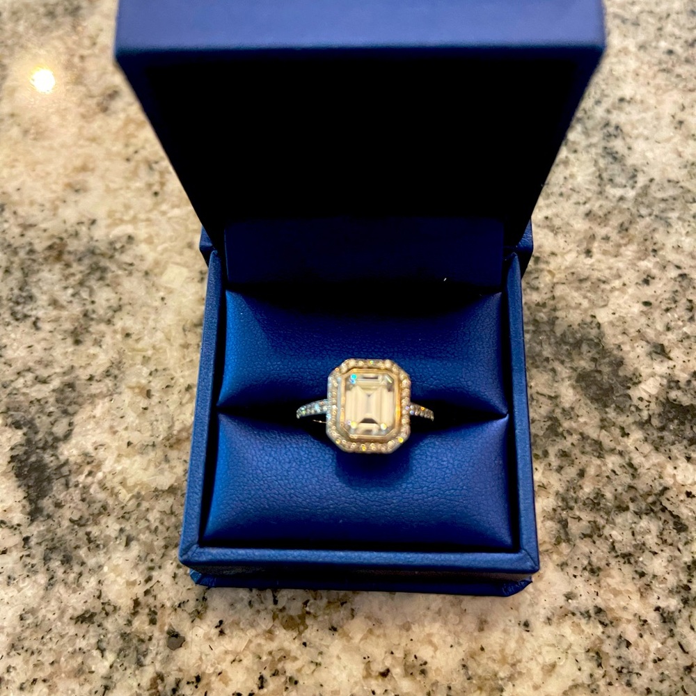 Beautiful emerald cut halo moissanite engagement ring